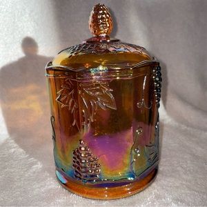 Collectible vintage biscuit jar. Grape leaf carnival glass, iridescent marigold.